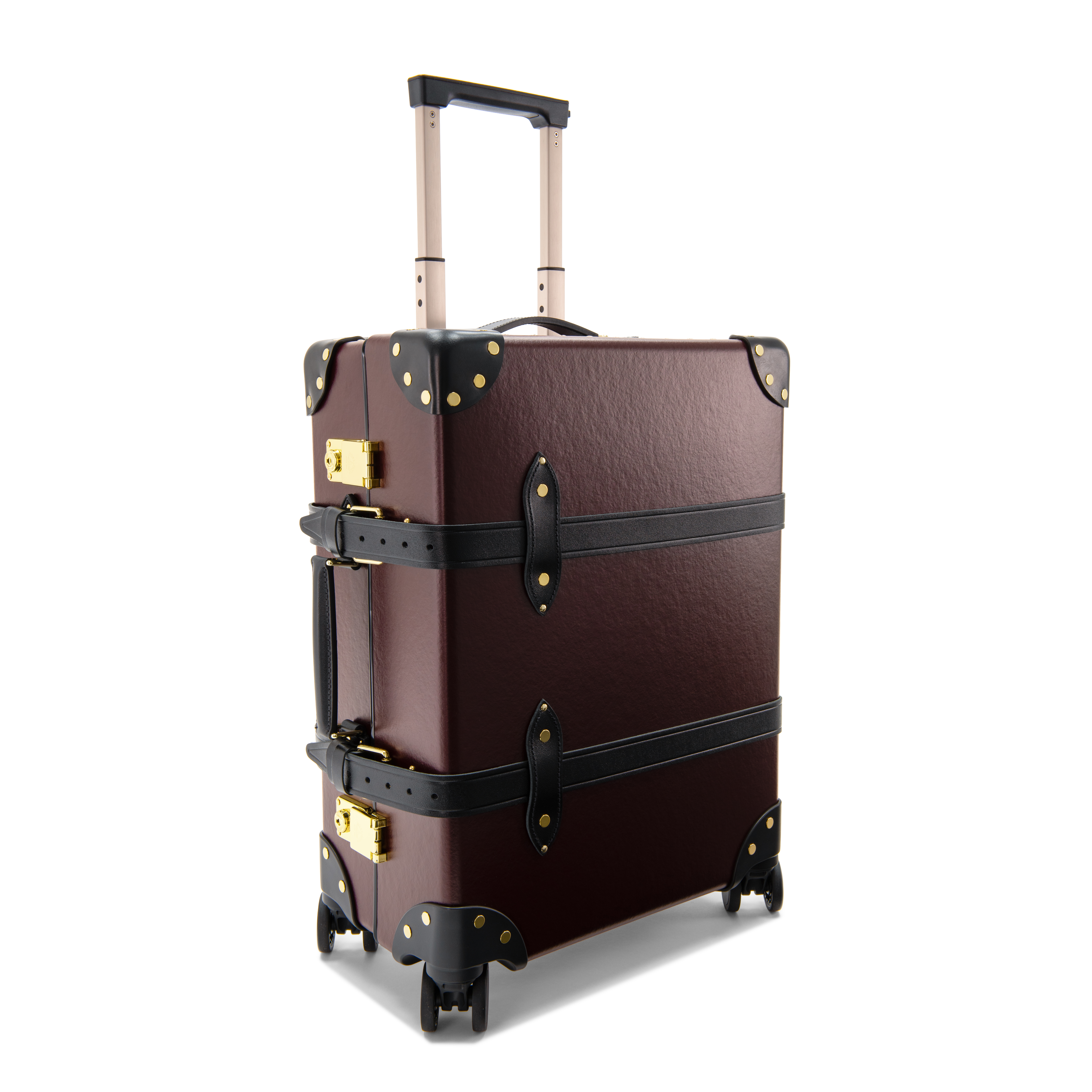 Oxblood suitcase photographed at an angle on a white background