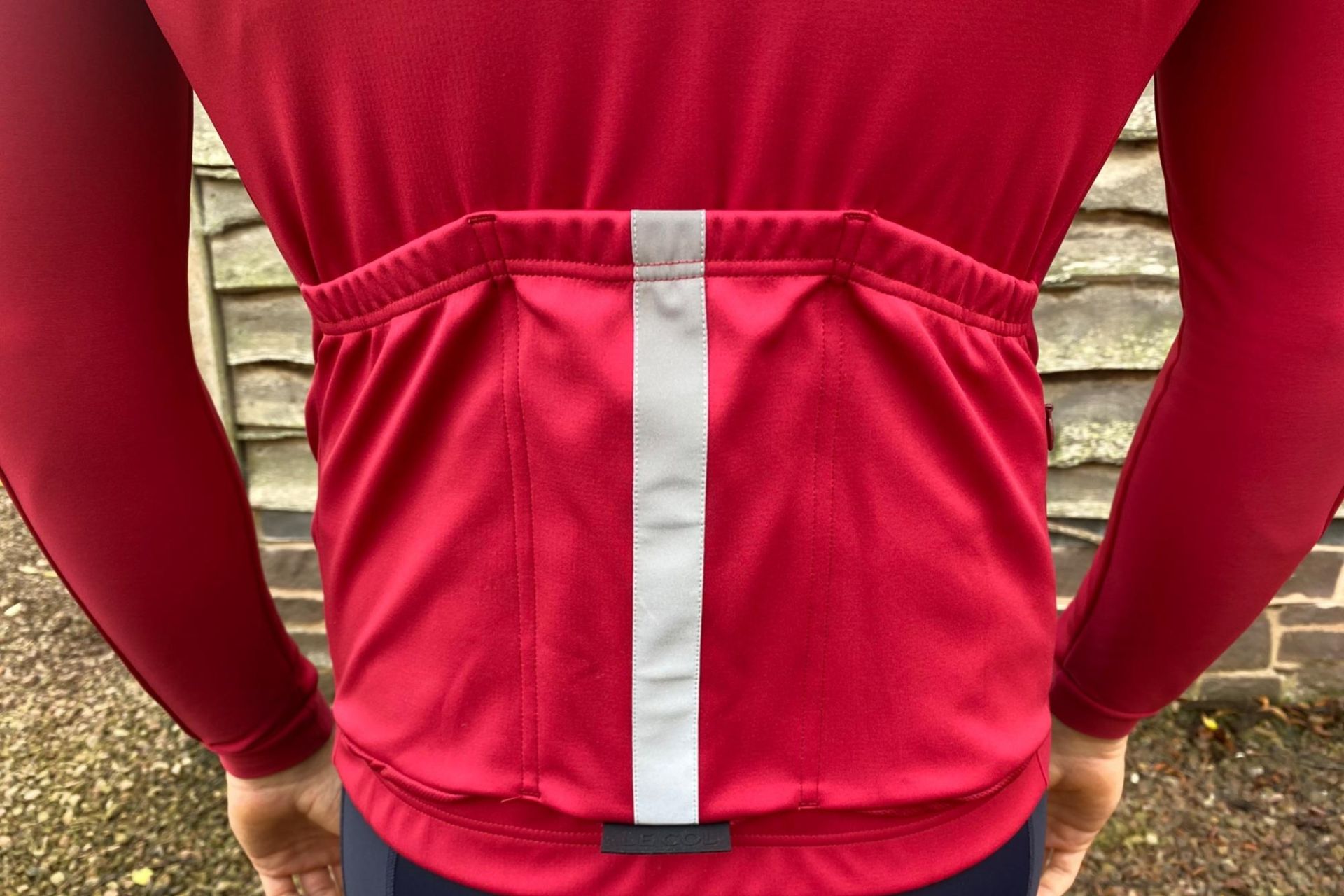 Image shows a rider wearing the Le Col Pro Jacket II.