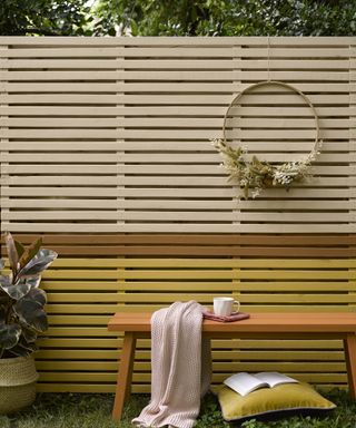 horizontal slatted fence painted in tonal stripes