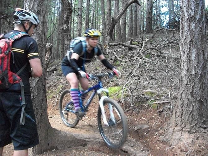 A NICA Coach teaching riders at the NorCal Rider Camp how to conquer switchbacks.
