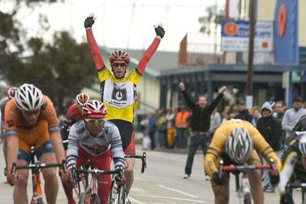 Double celebrations: Patrick Shaw (Virgin Blue/RBS Morgan) starts to celebrate his tour win as Malaysian National Team Manager Will Walker joins in for his rider's stage victory in the background.