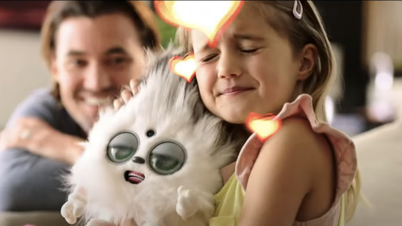 Girl hugging toy in Purrpetual Pets ad from M3GAN