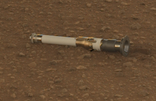 a tube lying on rocks on Mars