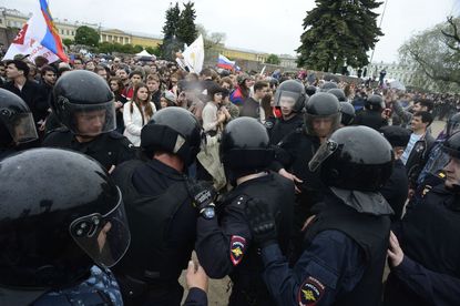 Russian police officers at opposition rally.