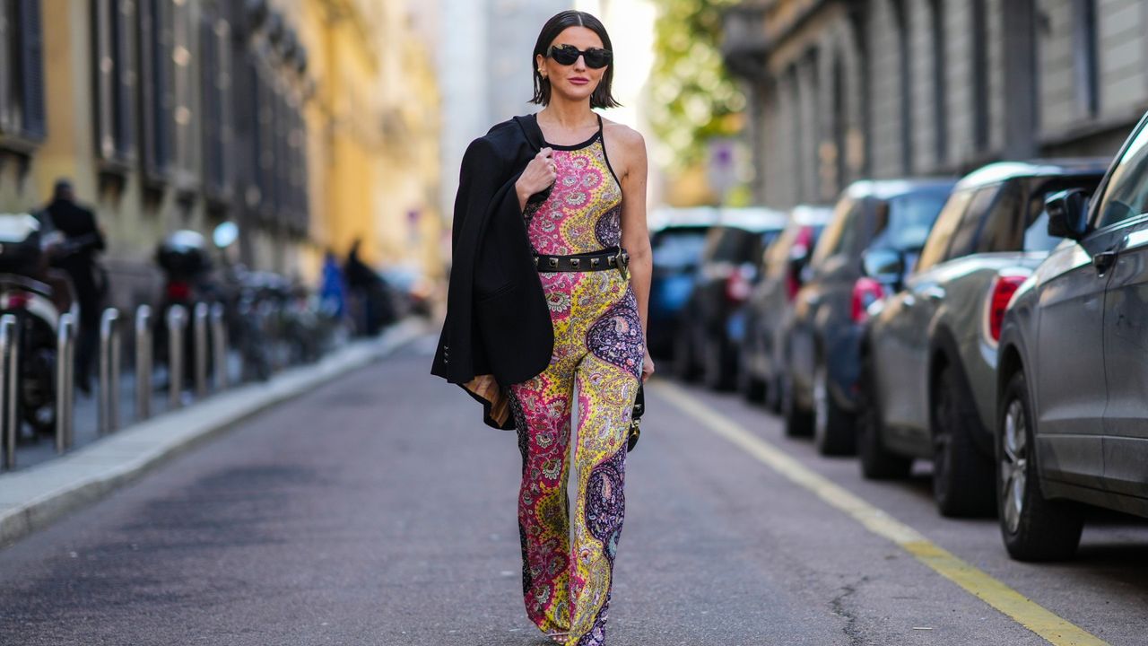 woman wearing a multi-colored catsuit