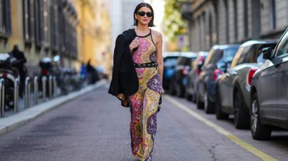 woman wearing a multi-colored jumpsuit