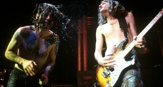 Ozzy Osbourne and Joe Holmes perform live in 1996.