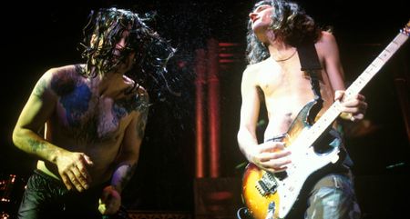 Ozzy Osbourne and Joe Holmes perform live in 1996.