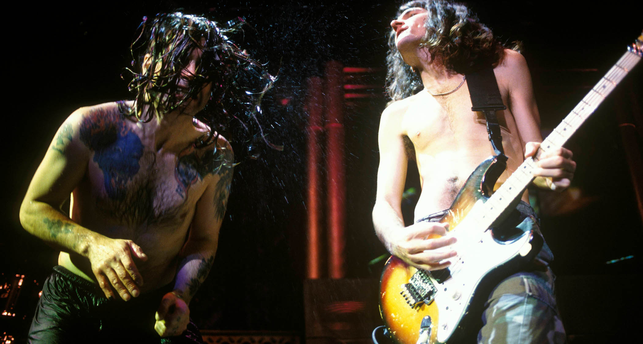 Ozzy Osbourne and Joe Holmes perform live in 1996.