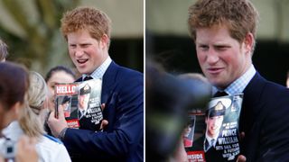 Prince Harry holding up a magazine with Prince William on the cover