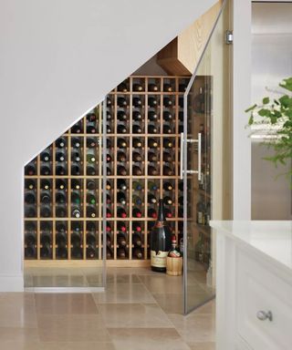 Under the stairs wine storage by Tom Howley