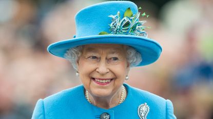 permanent bank holiday Queen Elizabeth II tours Queen Mother Square on October 27, 2016 in Poundbury, Dorset