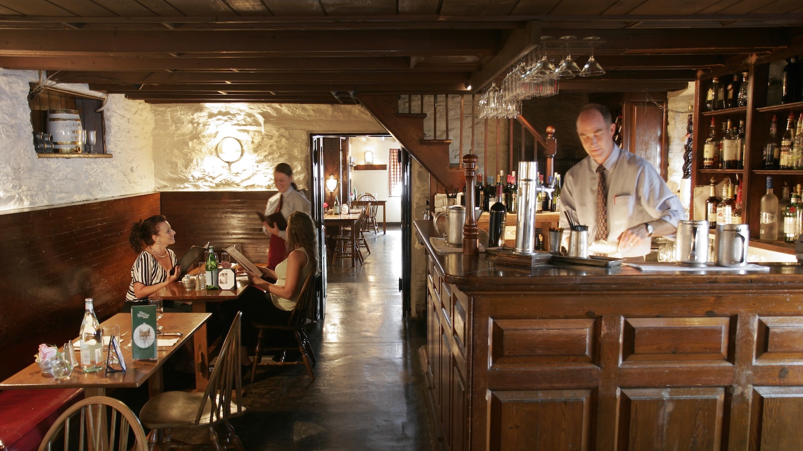 The wood-beamed bar area at the historic Red Fox Inn and Tavern in Middleburg, Virginia.