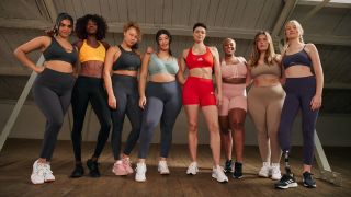 Women standing in a line wearing sports bras from Adidas’s spring-summer 2022 collection