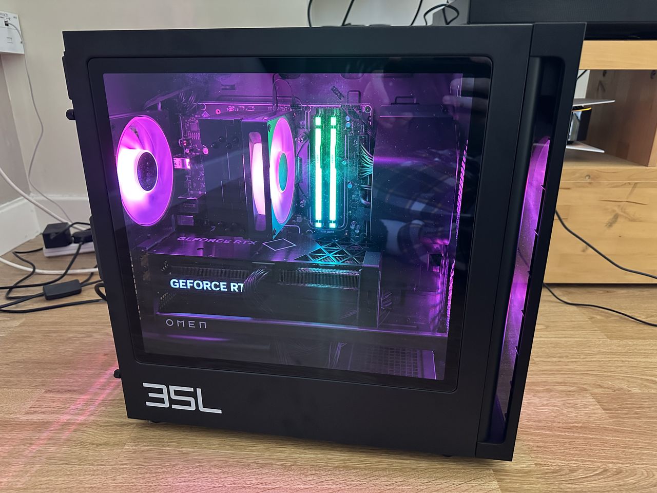The innards of the HP Omen 35L with pink lighting