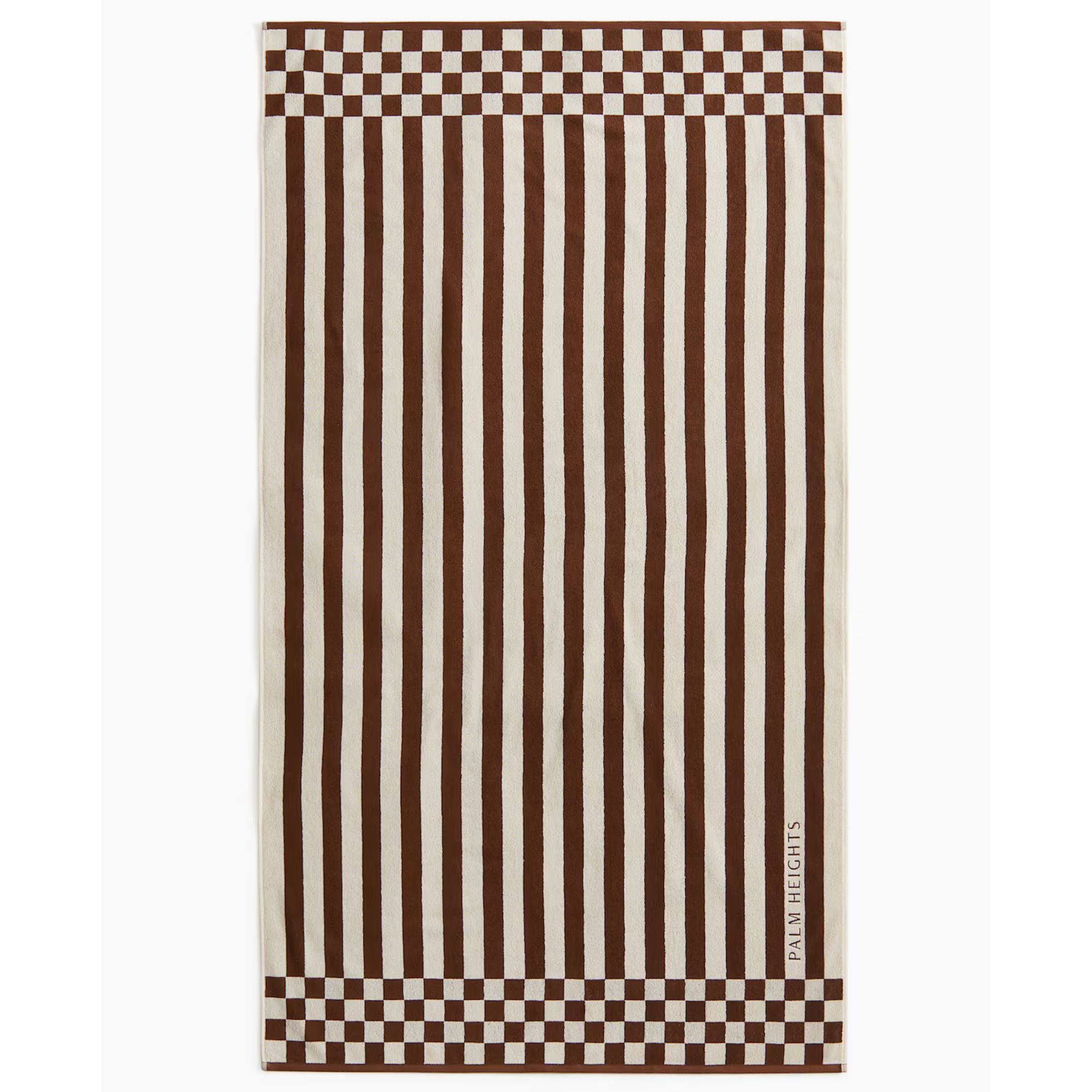 Striped brown and cream towel with checkerboard edges