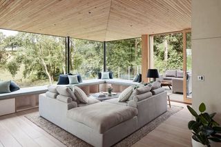Open plan living room with corner grey sofa
