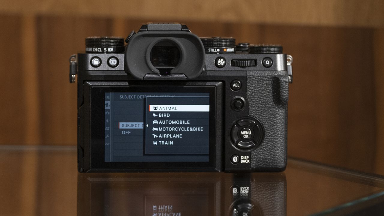 The Fujifilm X-T5 camera sitting on a table