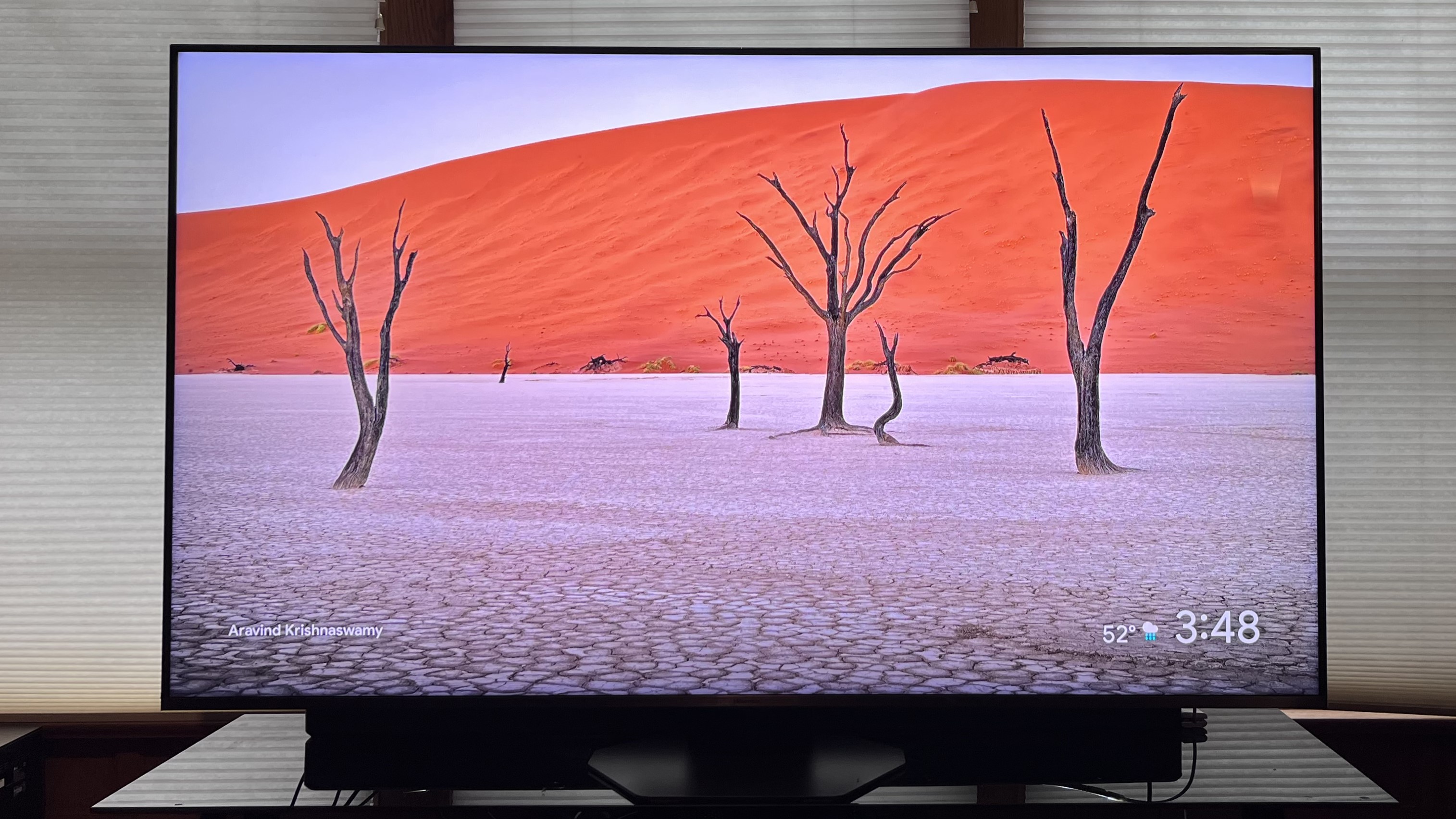 Hisense U8QG showing image of trees with orange background