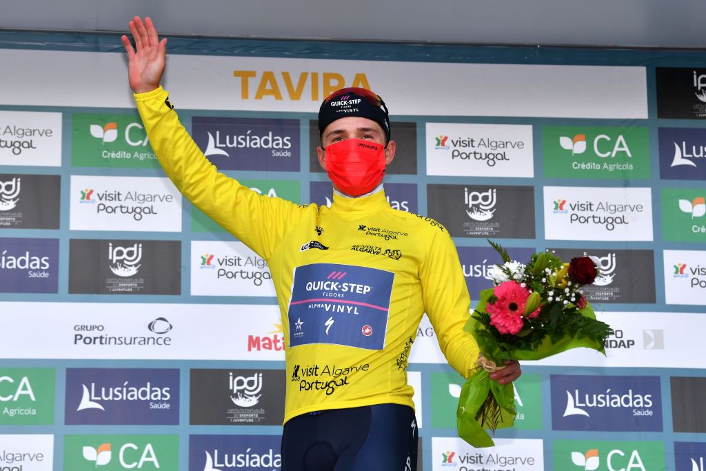 TAVIRA PORTUGAL FEBRUARY 19 Remco Evenepoel of Belgium and Team QuickStep Alpha Vinyl celebrates at podium as Yellow Leader Jersey winner during the 48th Volta Ao Algarve 2022 Stage 4 a 322km individual time trial from Vila Real de Santo Antnio to Tavira VAlgarve2022 on February 19 2022 in Tavira Portugal Photo by Luc ClaessenGetty Images