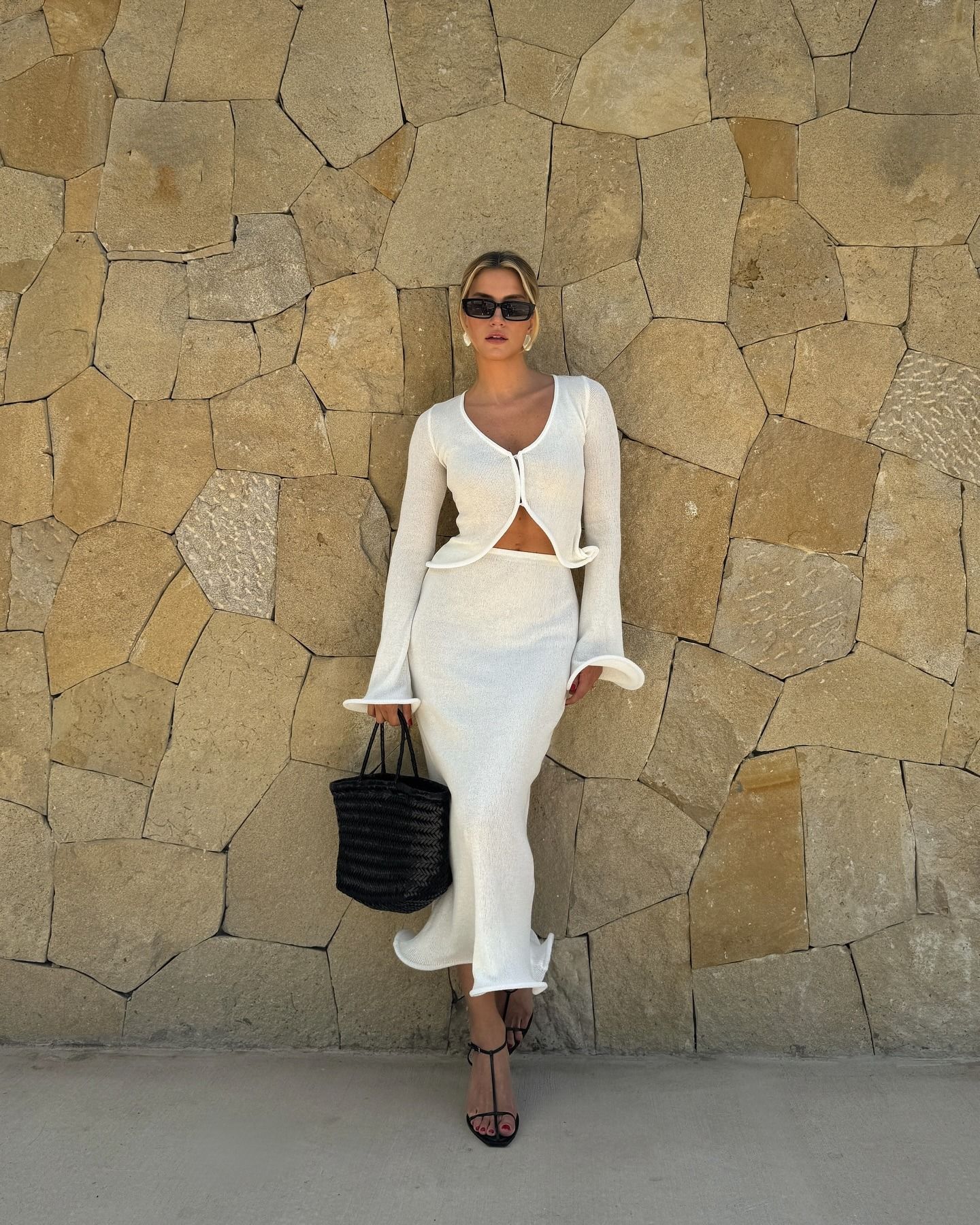 Photo of influencer wearing two-piece skirt set in the summer.