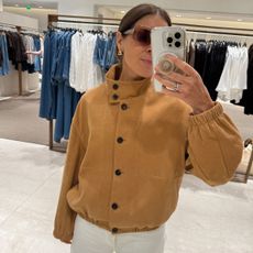 Woman in funnel-neck jacket