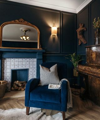 Modern blue living room with a blue velvet armchair and a fireplace using stick-on tile decor