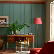 A home office with panelled walls painted in Little Greene's new Perpetual Blue shade