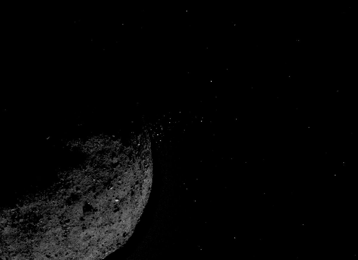 This view of the asteroid Bennu ejecting particles from its surface on Jan. 19, 2019, was created by combining two images taken by NASA&#039;s OSIRIS-REx spacecraft: a short-exposure photo, which shows the asteroid clearly, and a long-exposure version, which shows the particles clearly. Other image-processing techniques were also applied, such as cropping and adjusting the brightness and contrast of each layer.