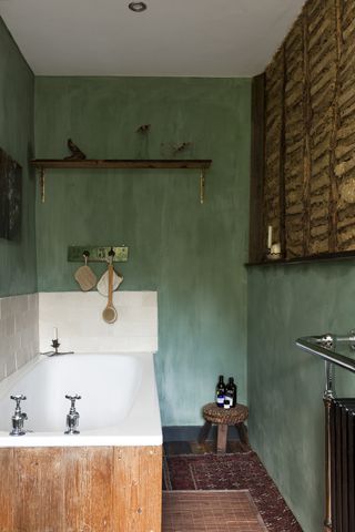 vintage blue bathroom with white built in bath