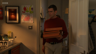 Jack Branning holding pizza boxes
