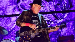 Neil Young performs with Old Black, his Gibson Les Paul, during 2017 Farm Aid on September 16, 2017 in Burgettstown, Pennsylvania. 