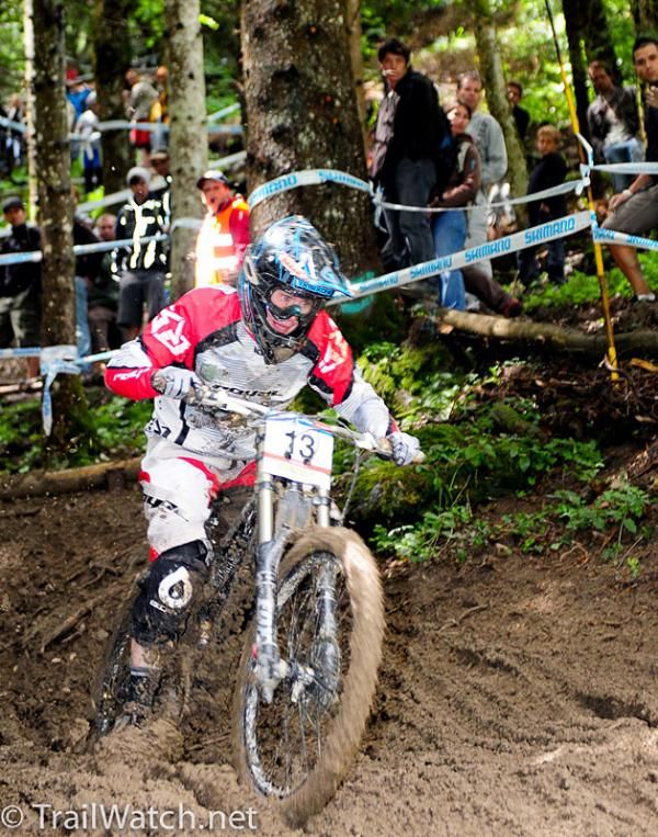 Katy Curd slogging through some deep mud.