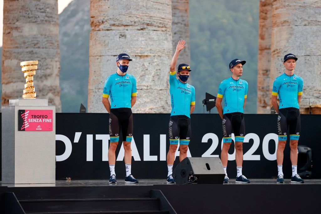 Riders of Astana Pro Team pose on stage at the Doric Temple of Segesta near Palermo Sicily on October 1 2020 during an opening ceremony of presentation of participating teams and riders two days ahead of the departure of the Giro dItalia 2020 cycling race Photo by Luca Bettini AFP Photo by LUCA BETTINIAFP via Getty Images