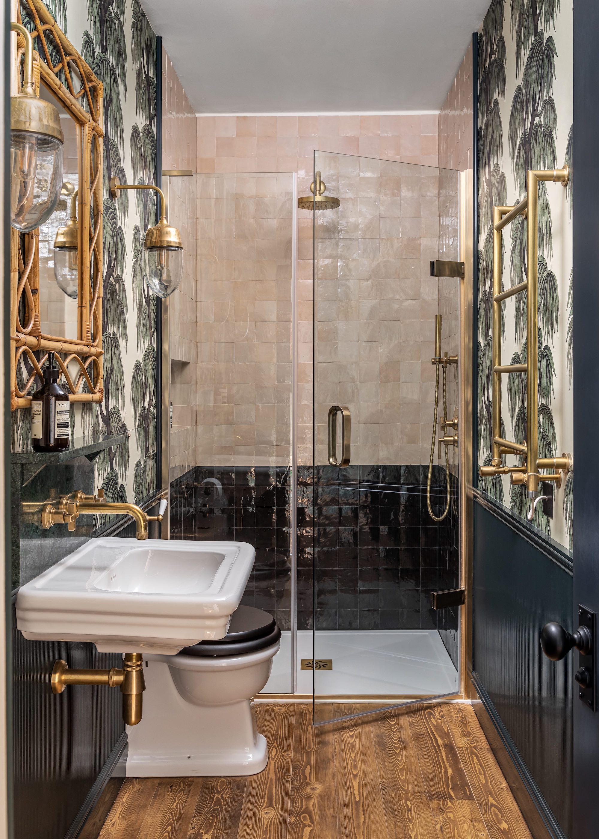 shower with black and pink walls and wallpaper with tree pattern