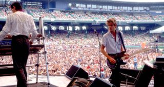 The Fixx's Jamie West-Oram and Rupert Greenall onstage at Comiskey Park, Chicago