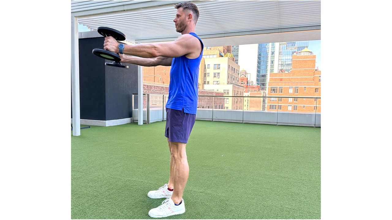 Andy Speer starting a dumbbell swing