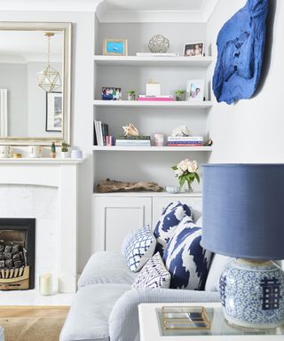 Alcove storage solution in a newly renovated blue living room