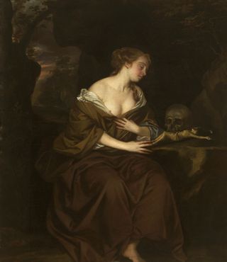 Lady in a brown dress and a skull