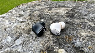 Beats Studio Buds Plus on a rock, old and new buds