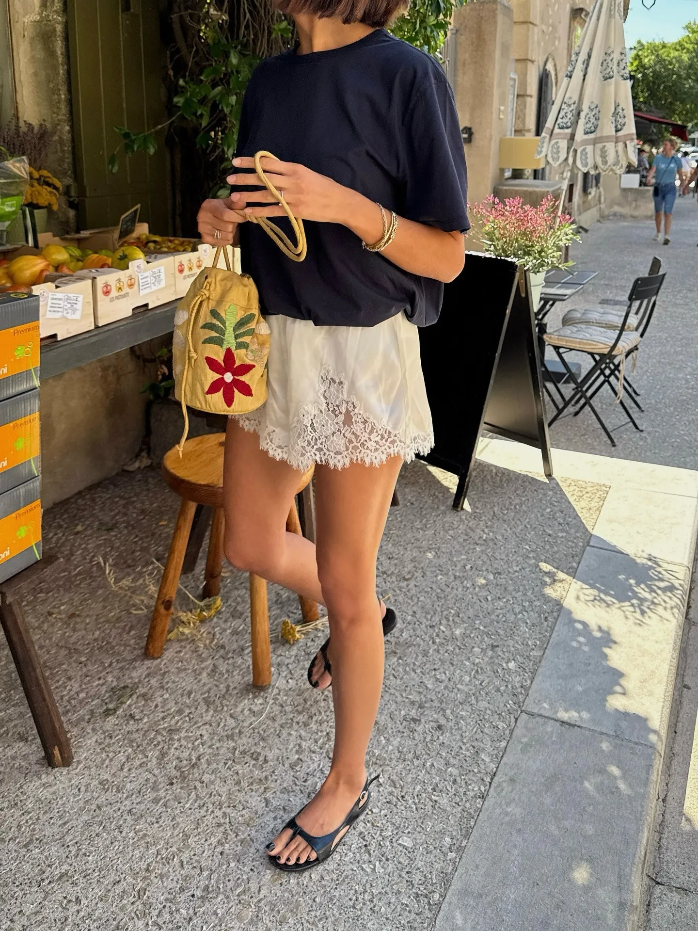 Woman in a relaxed tee and lace-trim shorts