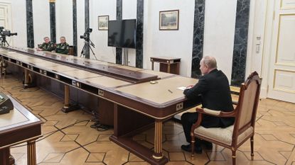 Vladimir Putin meets with his defence minister and chief of the general staff in Moscow