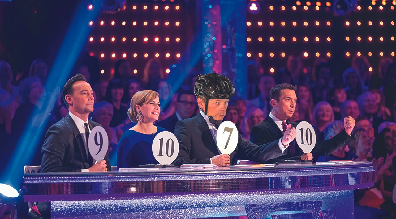 Image of Dr Hutch holding up a 7 in Strictly Come Dancing judging line up