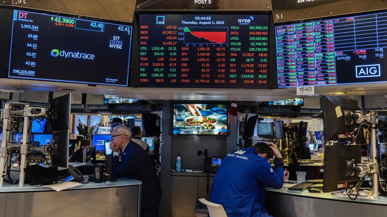 Traders looks dismally at the New York Stock Exchange numbers on Aug. 1, 2024