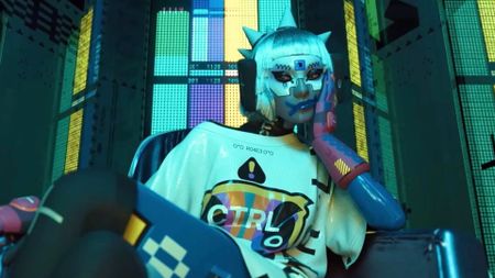 Marathon: A punk Vandal sitting in a chair hold her head up with her left hand.