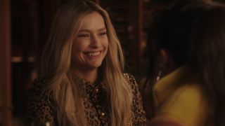 Camille smiling at Mindy in Emily in Paris.