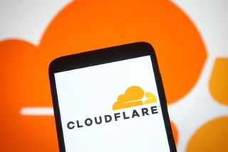 Cloudflare logo appearing on a smartphone against a Cloudflare-orange background