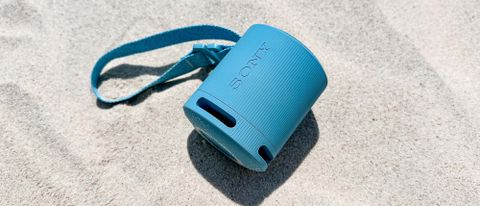 Sony SRS-XB100 sitting in the sand on the beach