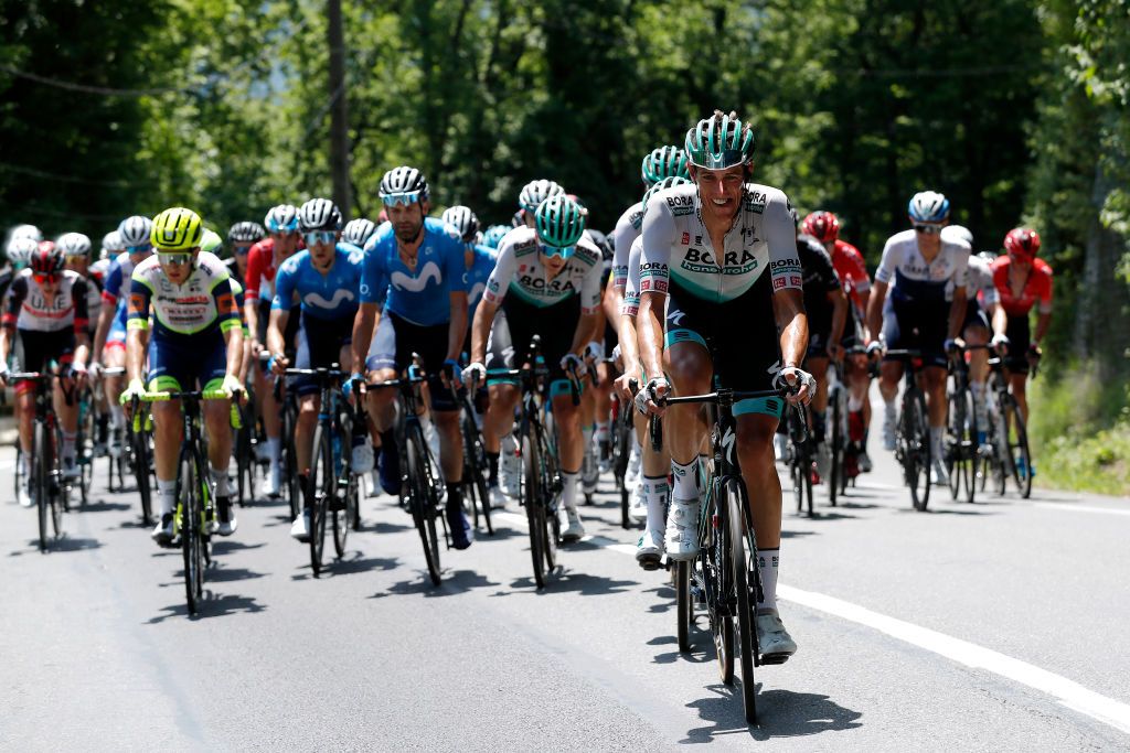 LE SAPPEYENCHARTREUSE FRANCE JUNE 04 Nils Politt of Germany and Team Bora Hansgrohe leads The Peloton during the 73rd Critrium du Dauphin 2021 Stage 6 a 1672km stage from LoriolsurDrome to Le SappeyenChartreuse 1003m UCIworldtour Dauphin dauphine on June 04 2021 in Le SappeyenChartreuse France Photo by Bas CzerwinskiGetty Images
