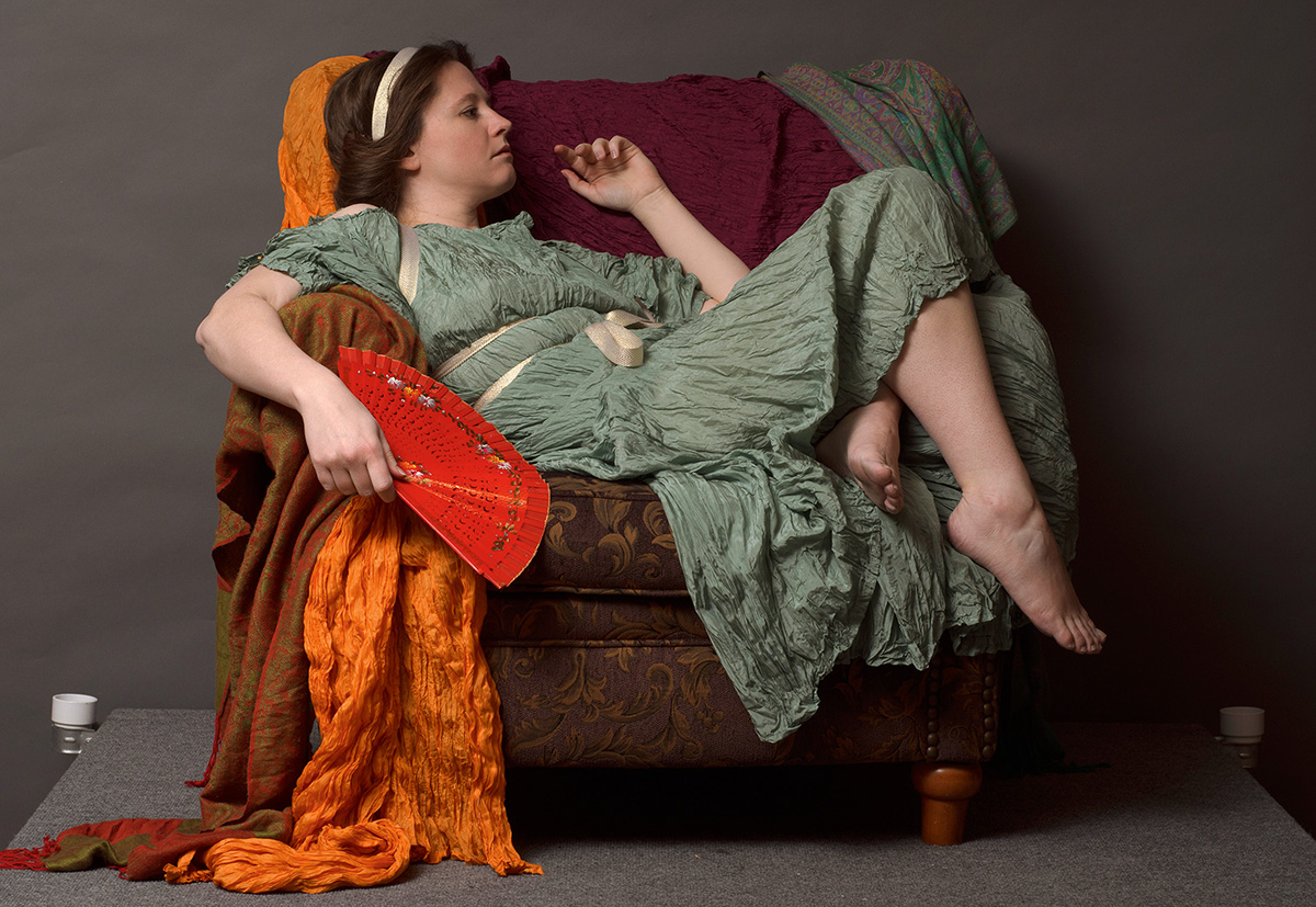 photograph of woman on a chair